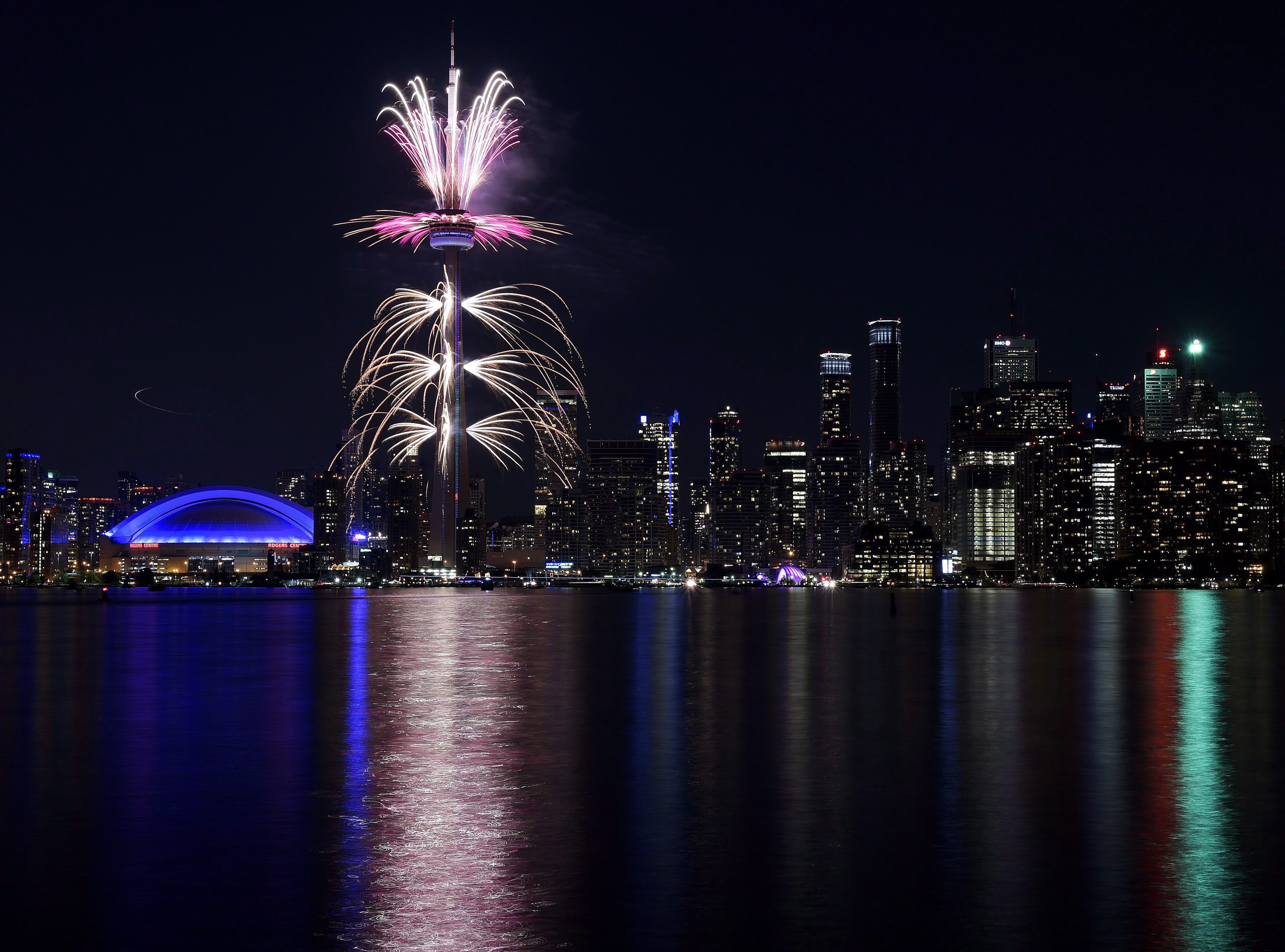 Fireworks light up the downtown Toronto city skyline during the closing ceremony for the Pan American Games