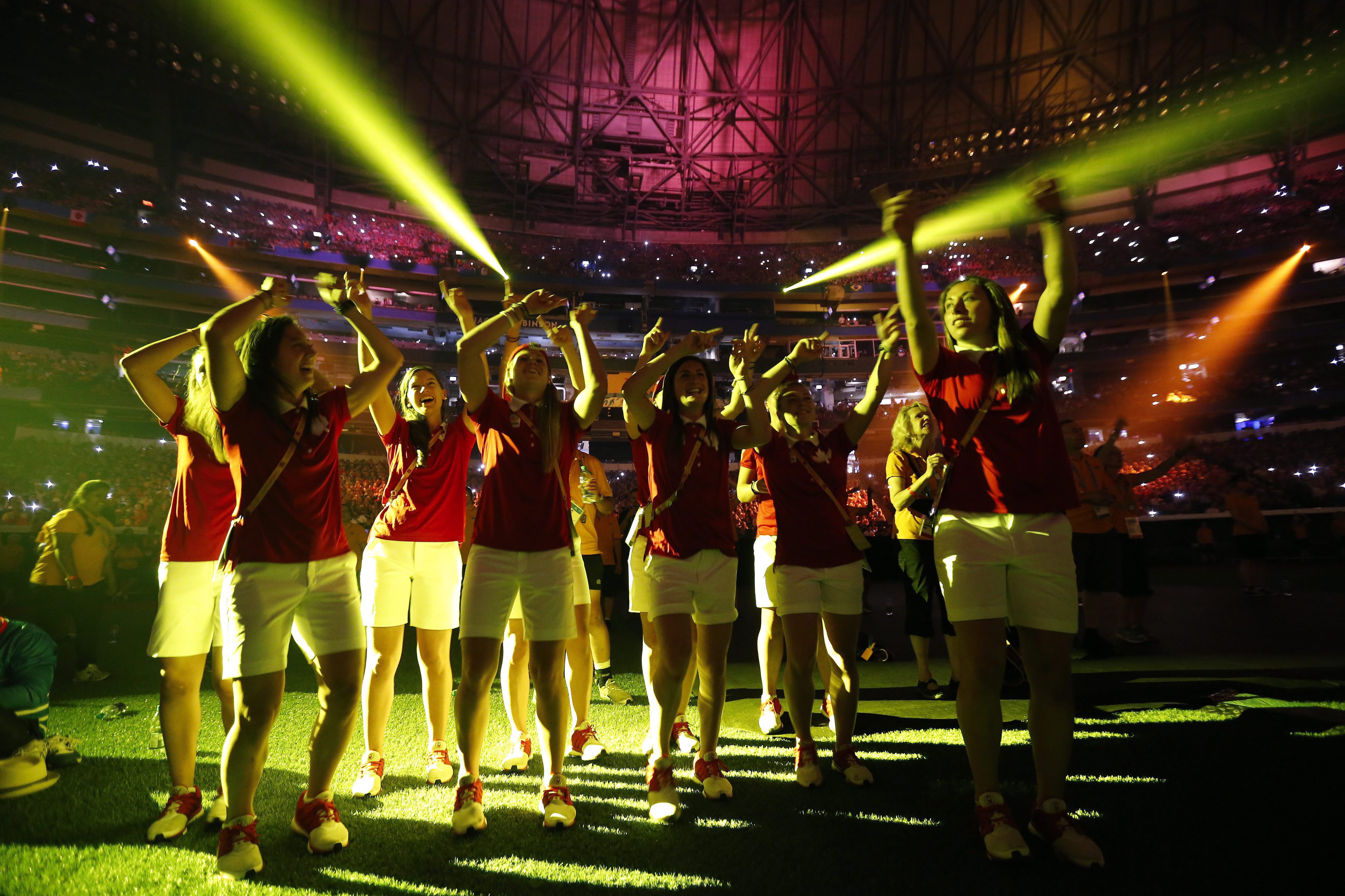 Canadian athletes dance during a performance at the closing ceremony of the Pan Am Games