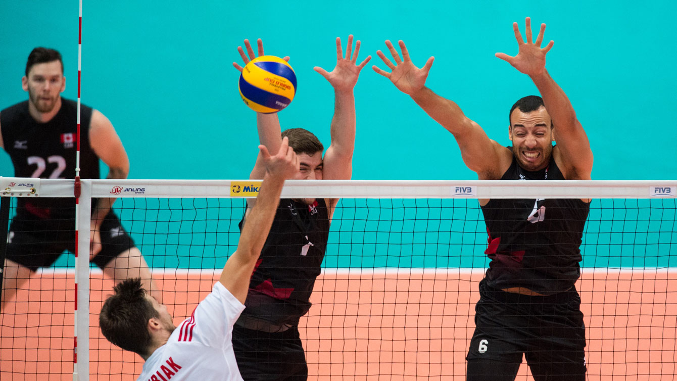 Canadians get up to block against Poland at the World Cup on September 16, 2015 (Photo: FIVB). 
