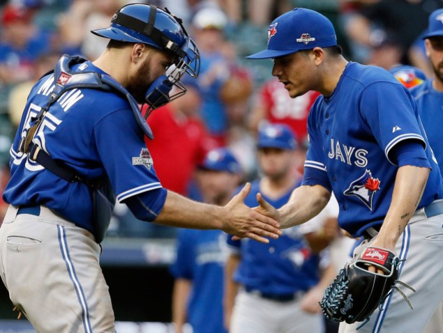 09726975 Russell Martin (left) has brought out the best in the Blue Jays' young pitchers, especially 20 year-old closer Roberto Osuna (right).