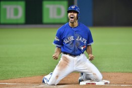 Dalton Pompey reacts to sliding in safe at third during Game 5 of the ALDS.