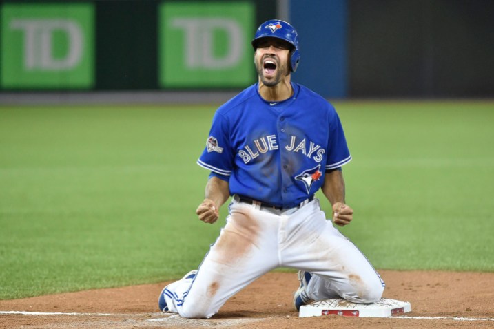 09742649 Dalton Pompey reacts to sliding in safe at third during Game 5 of the ALDS.