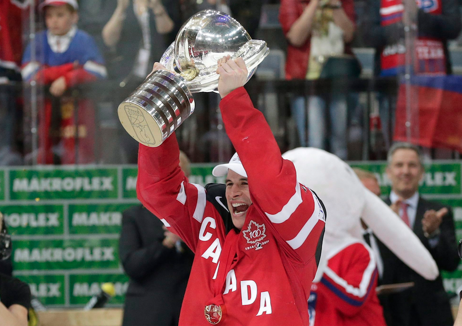 Team Canada captain Sidney Crosby hoists the 2016 IIHF World Championship trophy.