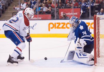 Toronto Maple Leafs goaltender James Reimer, right, makes a save on Montreal Canadiens forward Dale Weise during third period pre-season exhibition NHL hockey action in Toronto on Saturday, September 26, 2015.