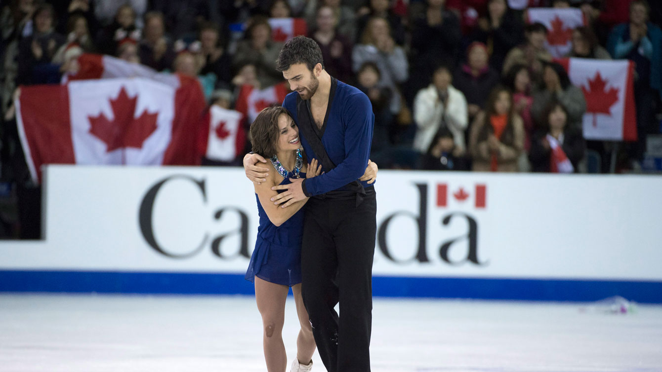 Meagan Duhamel and Eric Radford at the conclusion of their pairs free program at Skate Canada International on October 31, 2015. 