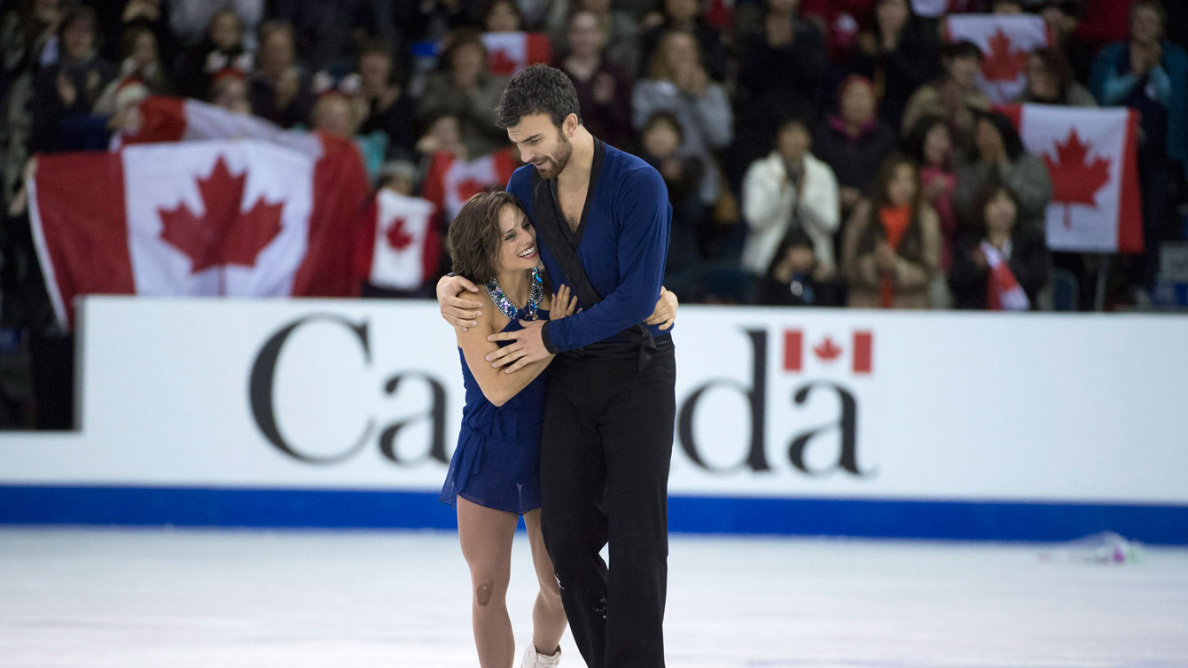 Meagan Duhamel and Eric Radford at the conclusion of their pairs free program at Skate Canada International on October 31, 2015.