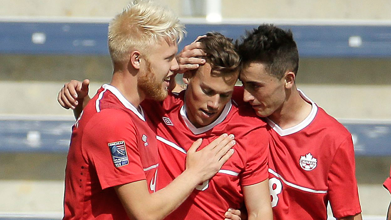 Ben Fisk (centre) congratulated by teammates after scoring against Panama in Olympic football qualifying on October 3, 2015.
