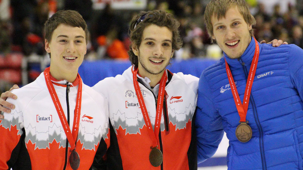 Sam Girard (centre) and Sasha Fathoullin (left) accept their medals after a 1-2 finish for Canada in the men's 500m on November 7, 2015 in Toronto.