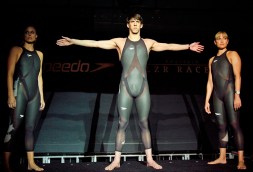 American swimmers Michael Phelps (centre), Amanda Beard (left), and Natalie Coughlin (right), show of Speedo's LZR Racer before Beijing 2008.