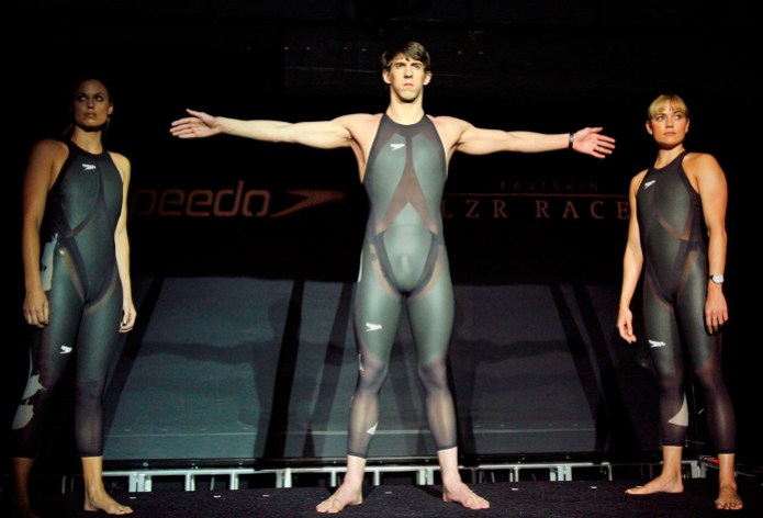 Phelps American swimmers Michael Phelps (centre), Amanda Beard (left), and Natalie Coughlin (right), show of Speedo's LZR Racer before Beijing 2008.