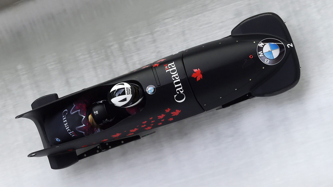 Kaillie Humphries and Melissa Lotholz race down the track in Konigssee, Germany at a World Cup event on December 11, 2015.