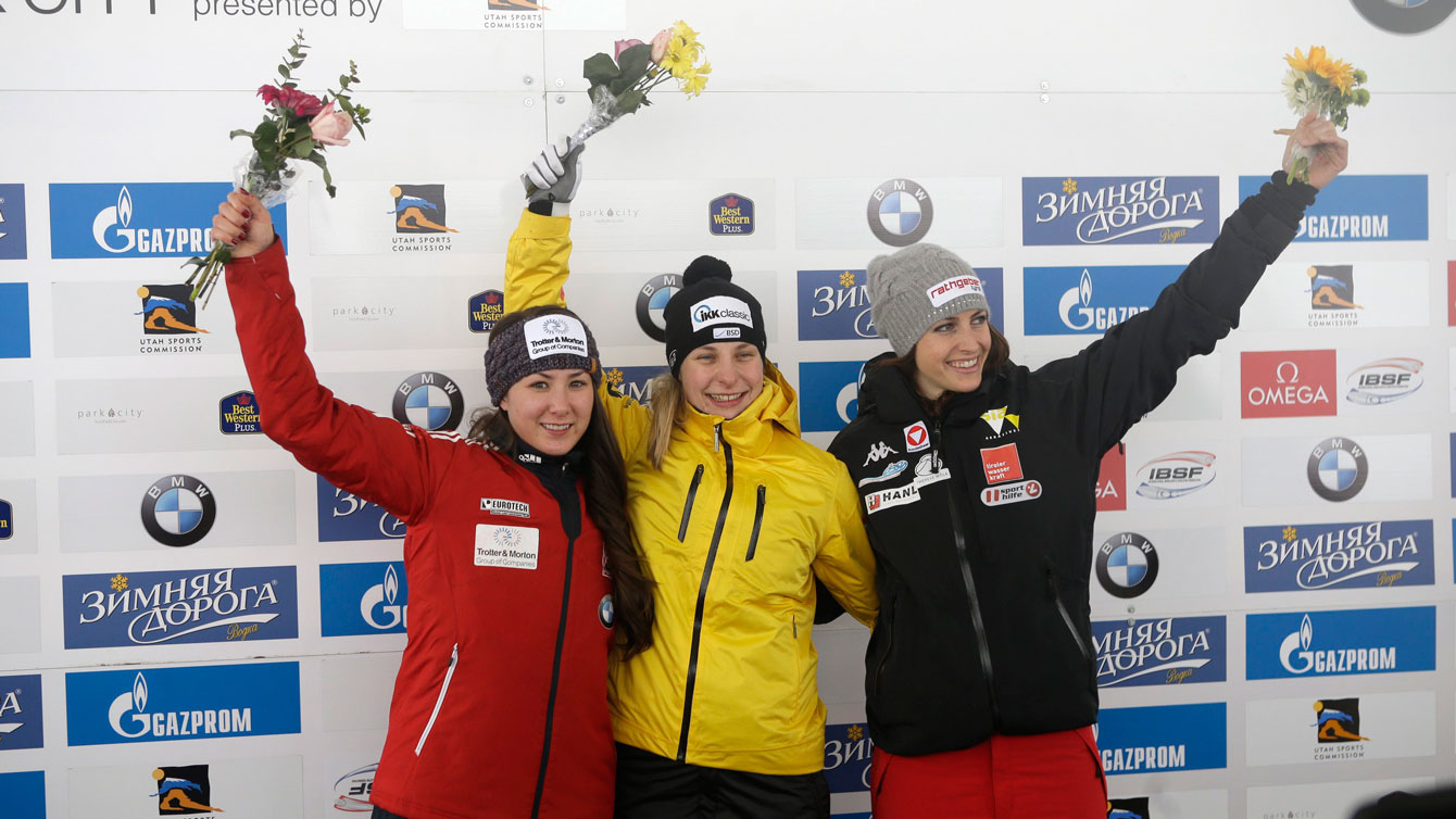 Jane Channell celebrates her second place World Cup finish in women's skeleton during the flower ceremony at Park City, Utah on January 16, 2016. 
