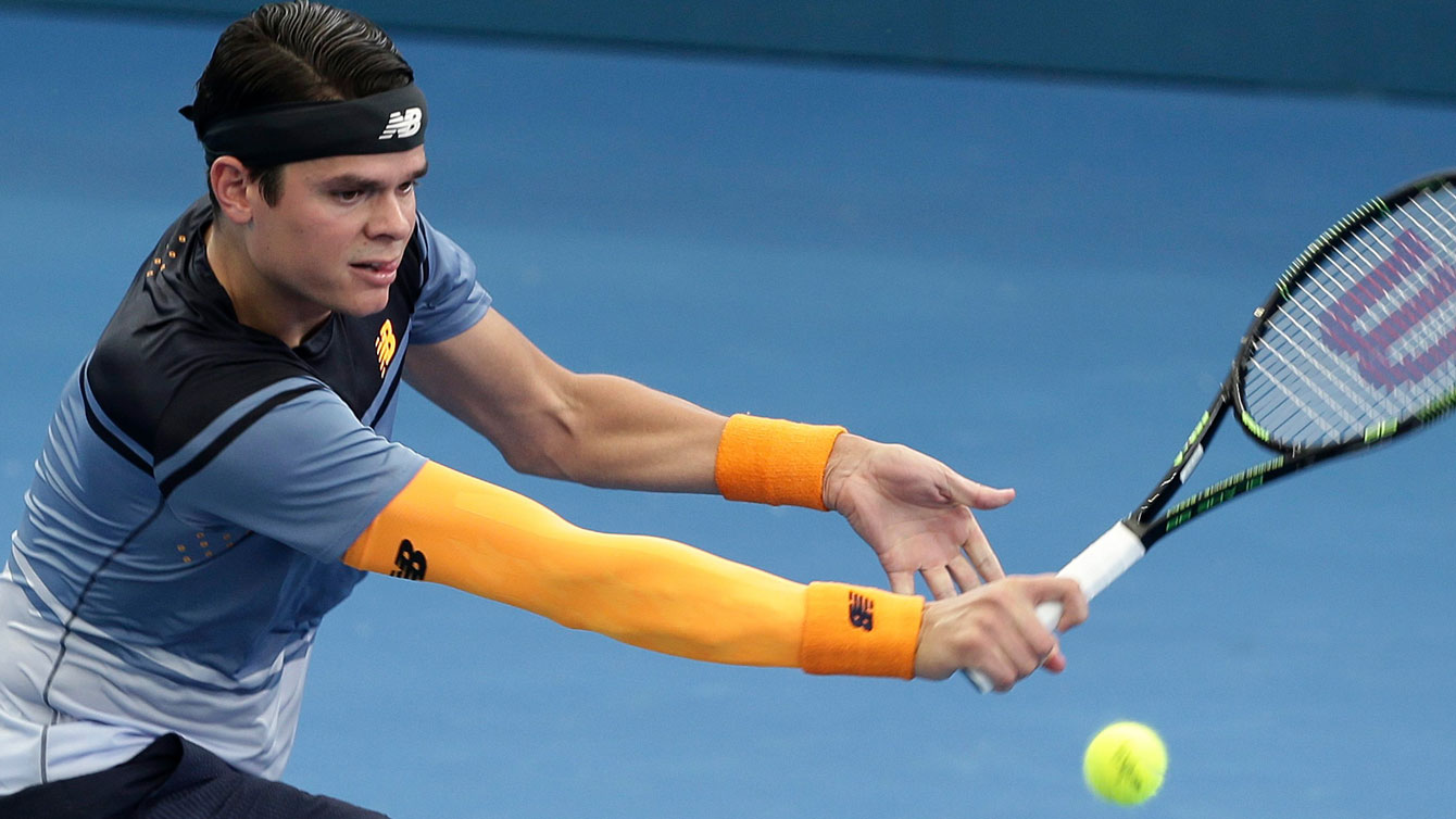 Milos Raonic returns during the Brisbane International on January 6, 2015. 