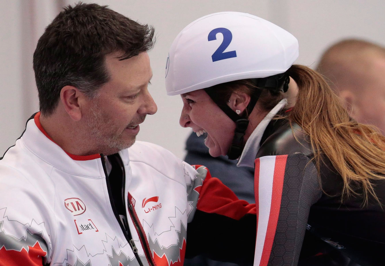 Blondin and her coach react after she won