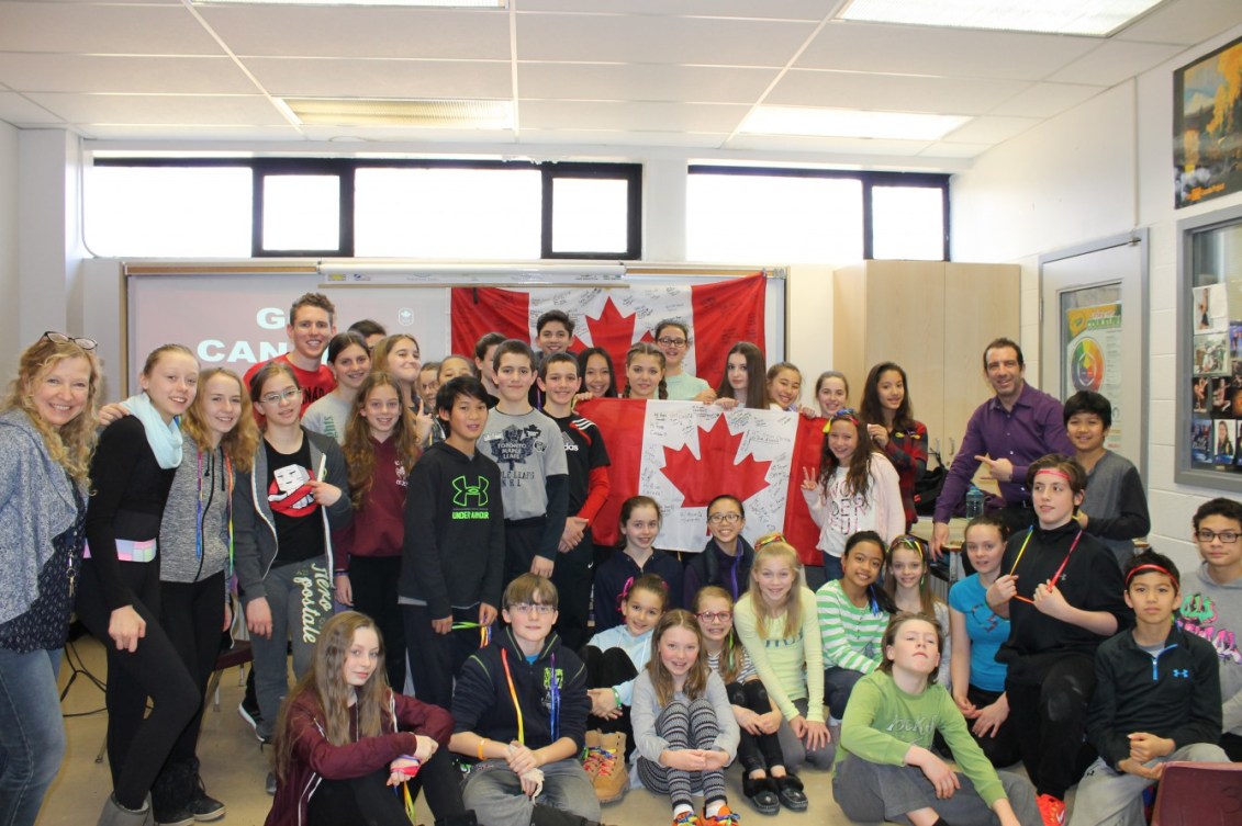 Eric Mitchell poses with grades 5, 6, 7 and 8 at St. Andrew's Junior High School.