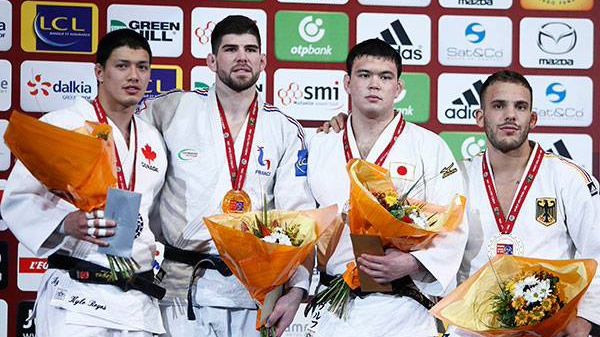 Kyle Reyes, left celebrates after finishing second in the men's 100kg at the Paris Grand Slam on February 7, 2016. Photo: International Judo Federation 
