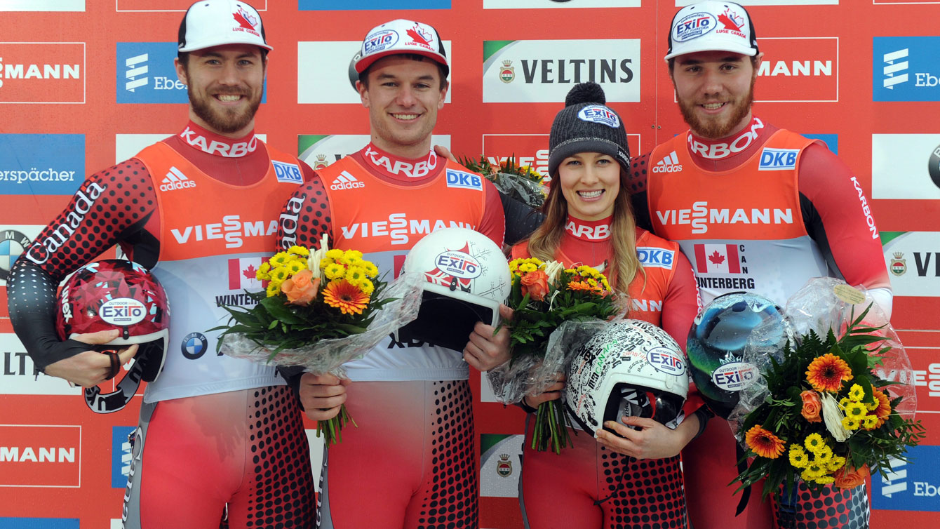 Canadians on the podium in first place at the Luge World Cup relay in Winterberg on February 21, 2016. 
