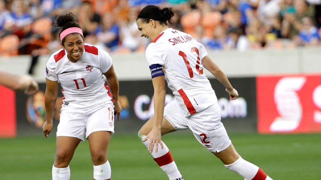 Christine Sinclair (right) celebrates her second goal against Costa Rica in Olympic qualifying with Desiree Scott looking on - February 19, 2016. 
