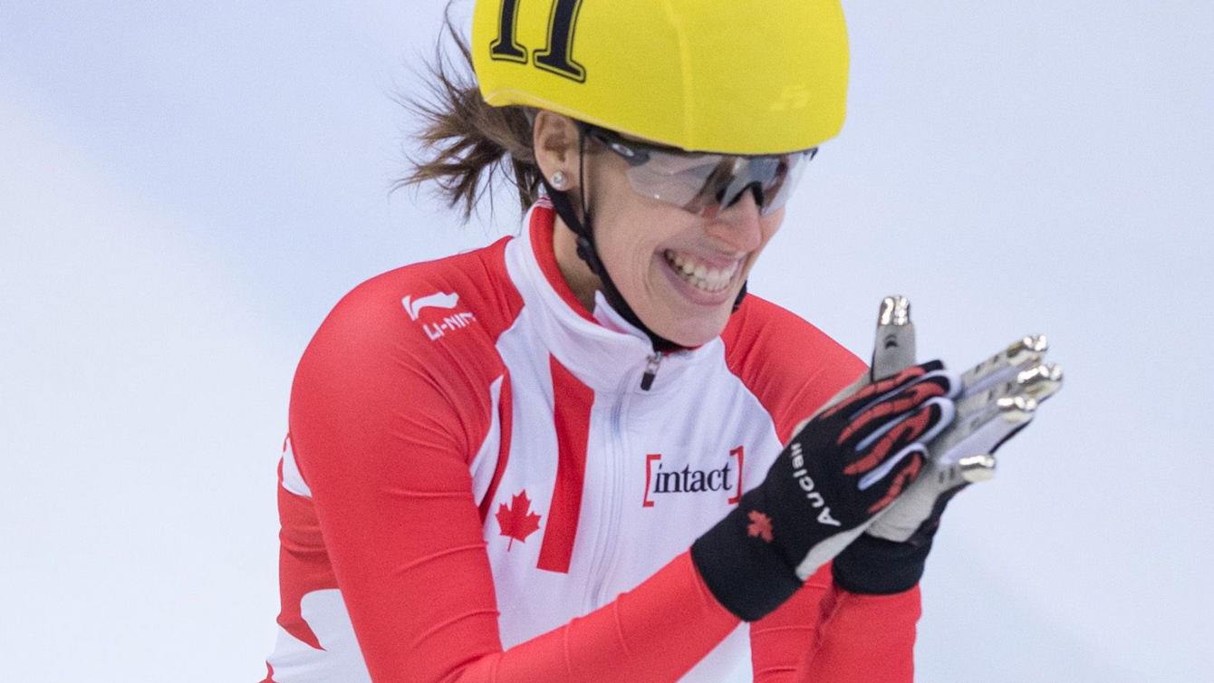 Marianne St-Gelais reacts after crossing the finish line as she won the women's 500 m final at the ISU Short track World Cup event in Dresden, Germany, Sunday Feb. 7, 2016. 