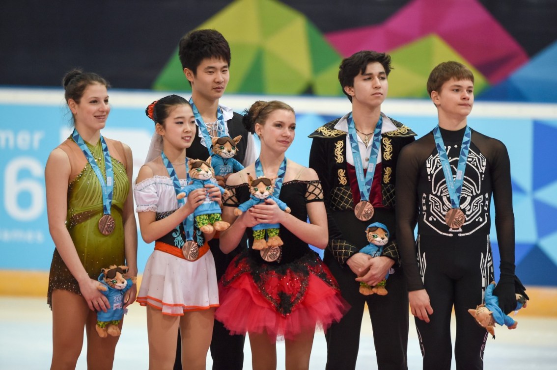 Fruzsina Medgyesi HUN, Yumeng Gao CHN, Bowen Li CHN, Marjorie Lajoie CAN, Zachary Lagha CAN and Deniss Vasiljevs LAT (left to right) pose with the Bronze Medals they won in the Figure Skating Mixed NOC Team event at Hamar Olympic Amphitheatre during the Winter Youth Olympic Games, Lillehammer, Norway, 20 February 2016. Photo: Thomas Lovelock for YIS/IOC Handout image supplied by YIS/IOC