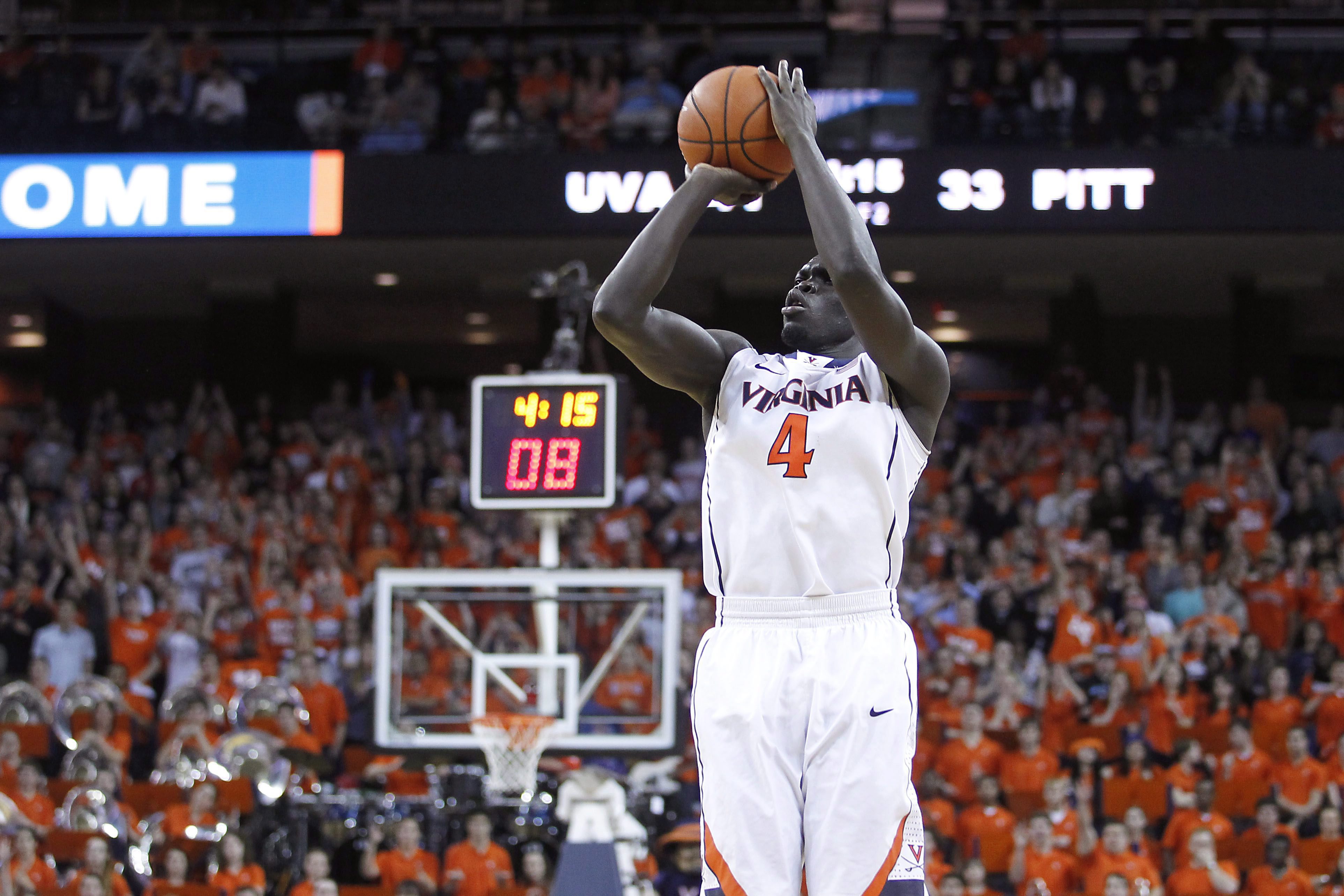 Virginia guard Marial Shayok (4) shoots during the second half of an NCAA college basketball game against Pittsburgh in Charlottesville, Va., on Monday, Feb. 16, 2015. Virginia won 61-49. (AP Photo/Ryan M. Kelly)