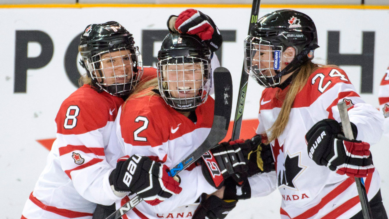 Meghan Agosta (2) is congratulated after her goal at the IIHF women's world championships on April 3, 2016. 