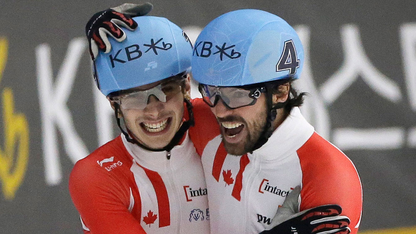 Charles Hamelin (right) and Samuel Girard celebrate going 1-2 at the World Short Track Speed Skating Championships in the 1000m on March 13, 2016 in Seoul, South Korea.