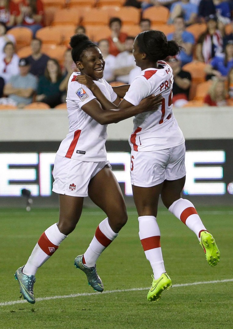 10805915 Canada's Deanne Rose, left, celebrates after scoring a goal with Nichelle Prince during the second half of a CONCACAF Olympic women's soccer qualifying championship semifinal against Costa Rica, Friday, Feb. 19, 2016, in Houston. Canada won 3-1. (AP Photo/David J. Phillip)