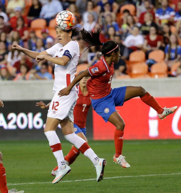 10806010 Canada's Christine Sinclair (12) heads the ball as Costa RicaÔø?s Diana Saenz (5) defends during the second half of a CONCACAF Olympic women's soccer qualifying championship semifinal Friday, Feb. 19, 2016, in Houston. Canada won 3-1. (AP Photo/David J. Phillip)