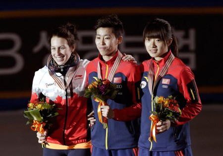 11019764 Gold medalist Wang Lexin, center, of China poses with silver medalist Marianne St-Gelais of Canada