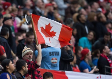 Fan A spectator dressed as a lumberjack waves a Canadian flag as Canada and England play during World Rugby Sevens Series' Canada Sevens bowl semi-final action, in Vancouver, B.C., on Sunday March 13, 2016. THE CANADIAN PRESS/Darryl Dyck