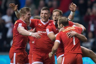 Canada's John Moonlight, from left to right, Adam Zaruba, Harry Jones, Nathan Hirayama and Sean White celebrate after Hirayama kicked a conversion to defeat France during World Rugby Sevens Series' Canada Sevens Bowl final action, in Vancouver, B.C., on Sunday March 13, 2016. THE CANADIAN PRESS/Darryl Dyck