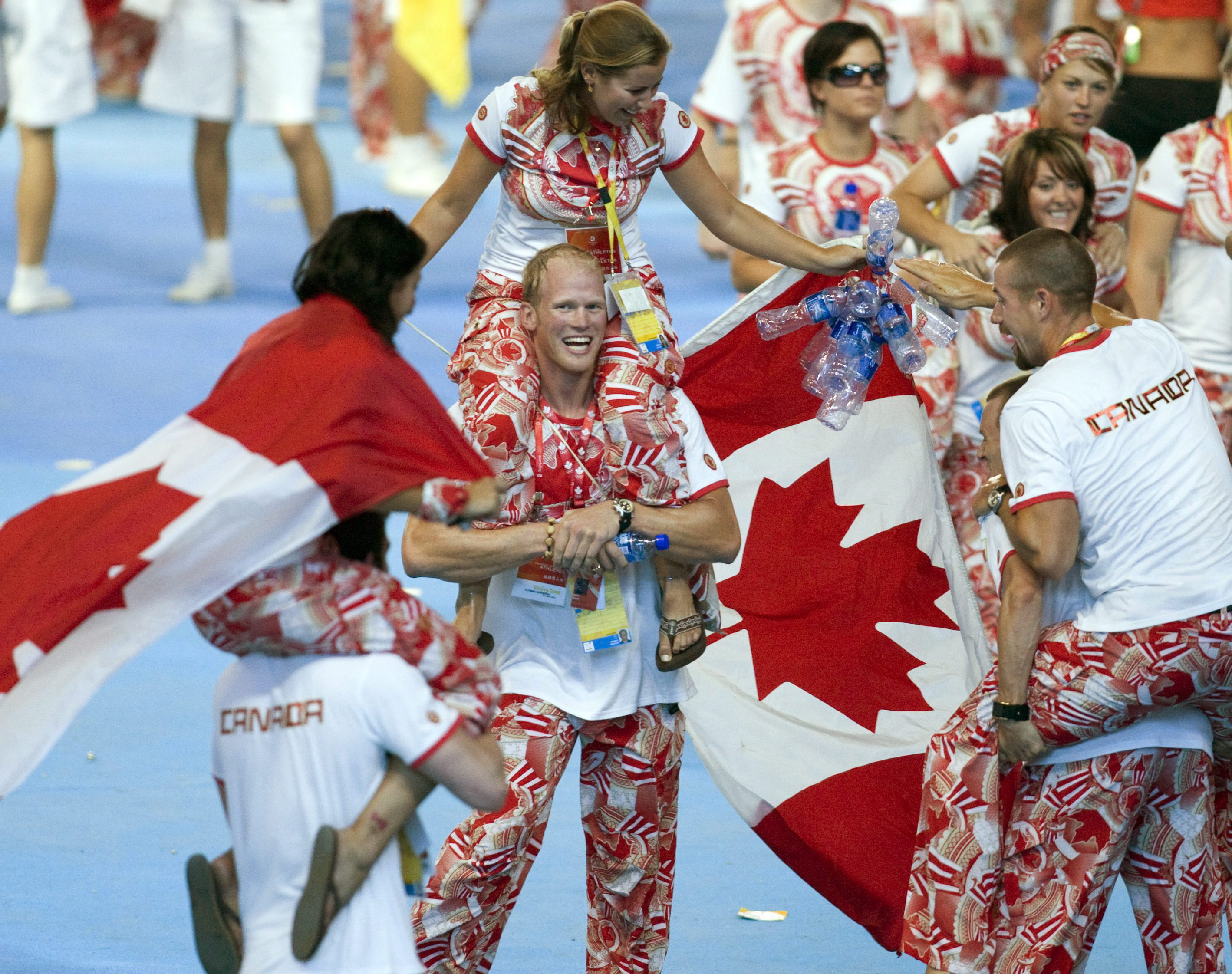 Canadian athletes celebrate during closing ceremony