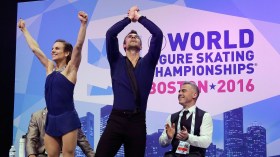 Meagan Duhamel and Eric Radford celebrate in the kiss and cry