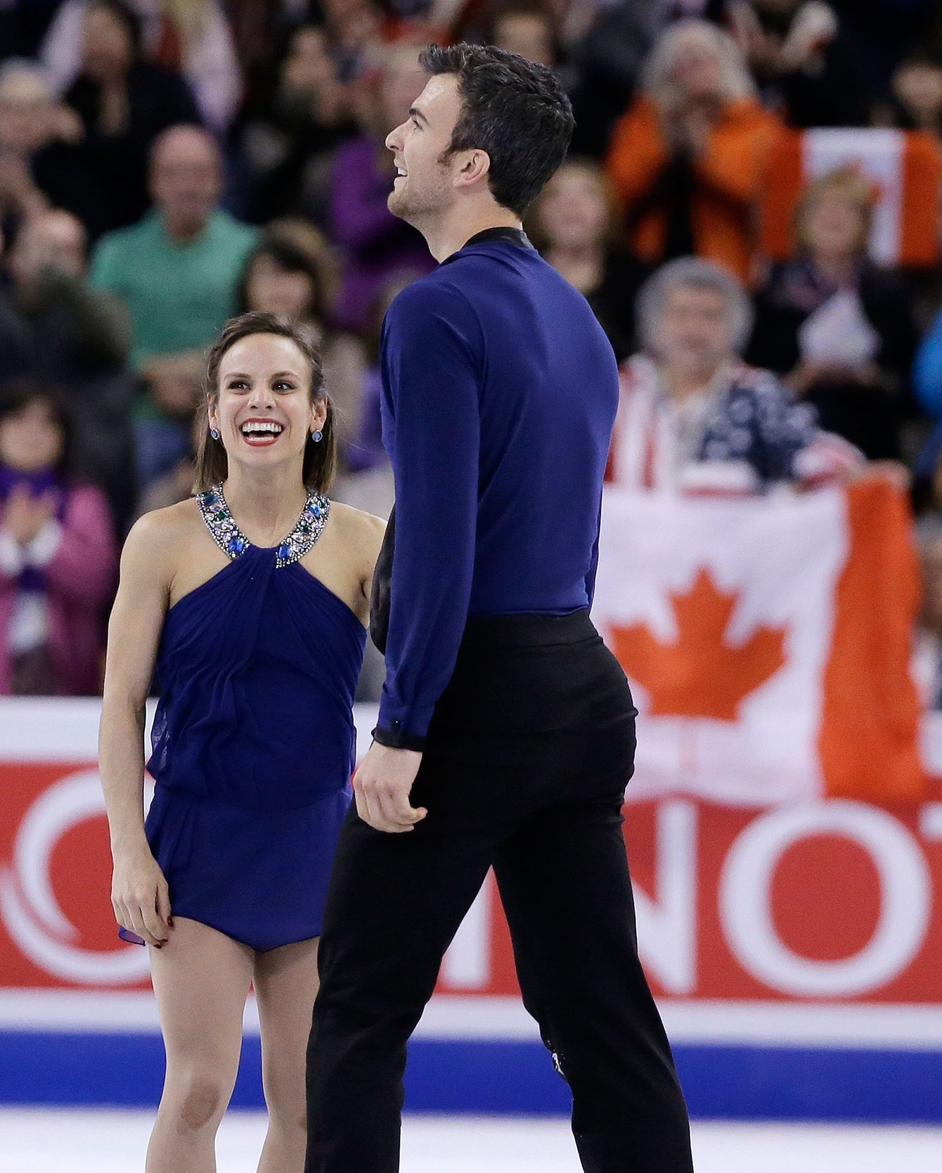 Meagan Duhamel and Eric Radford show relief after a monstrous performance in the free skate at the ISU Speed Skating World Championships on April 2, 2016. 