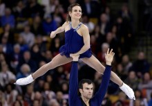 Eric Radford lifts Meagan Duhamel during their free skate at the ISU Figure Skating World Championships on April 2, 2016.