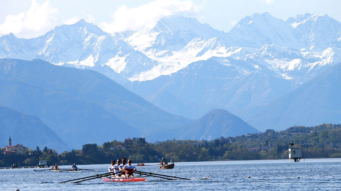 A Canadian boat in the foreground on the water in Varese, Italy during training at World Rowing Cup I (Photo: Igor Meijer via FISA/World Rowing). 