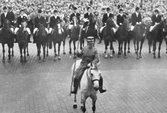 Man on horseback leads opening ceremony at 1956 equestrian games in Stockholm, Sweden