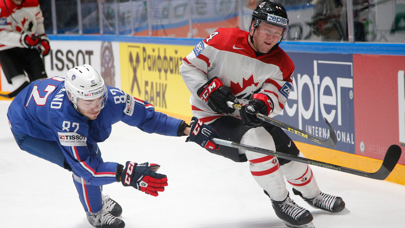 Canada’s Morgan Rilles vies with France’s Charles Bertrand at the Hockey World Championship in St.Petersburg, Russia, on May 16, 2016. (AP Photo/Dmitri Lovetsky)