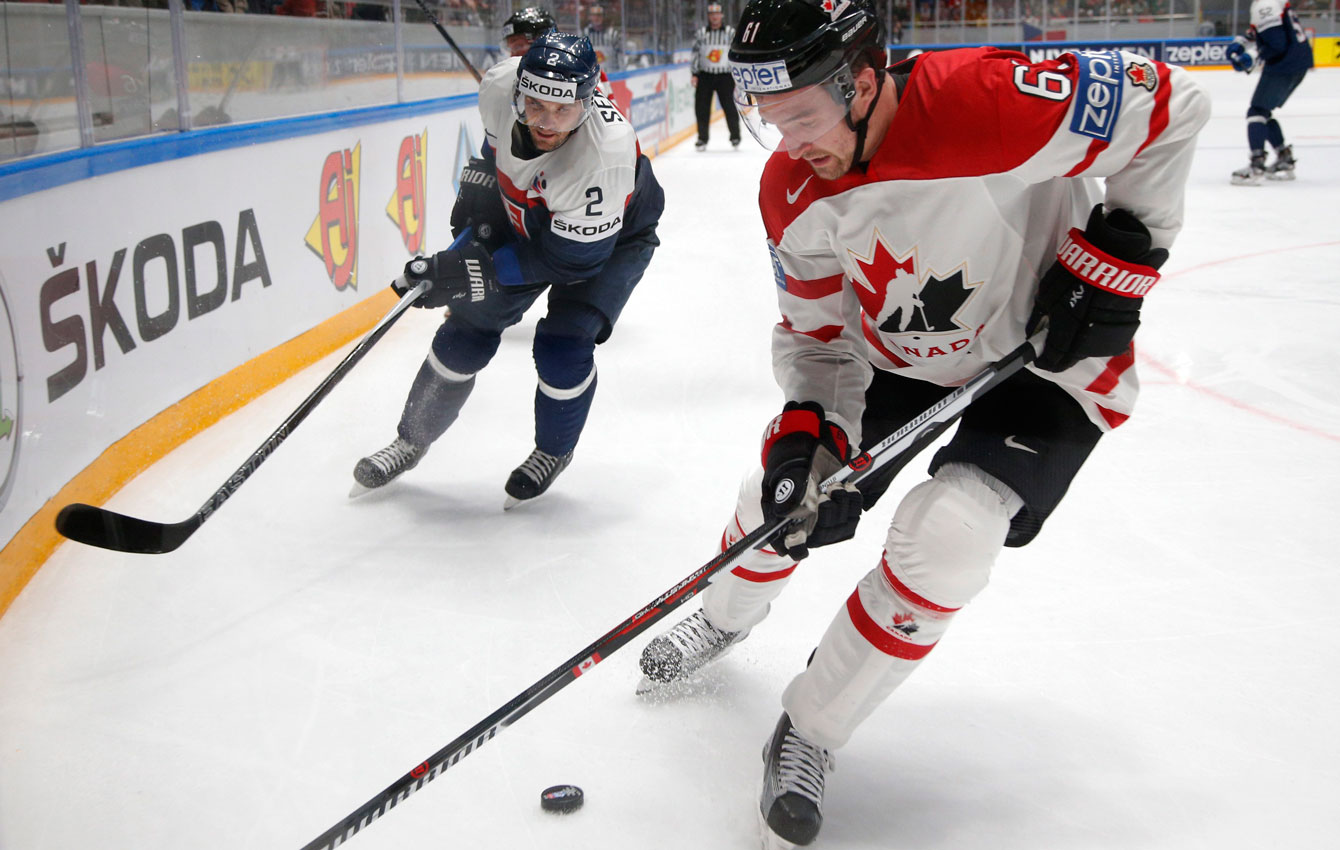 Mark Stone fights for the puck during the Hockey World Championships in St.Petersburg, Russia, on May 14, 2016. (AP Photo/Dmitri Lovetsky)