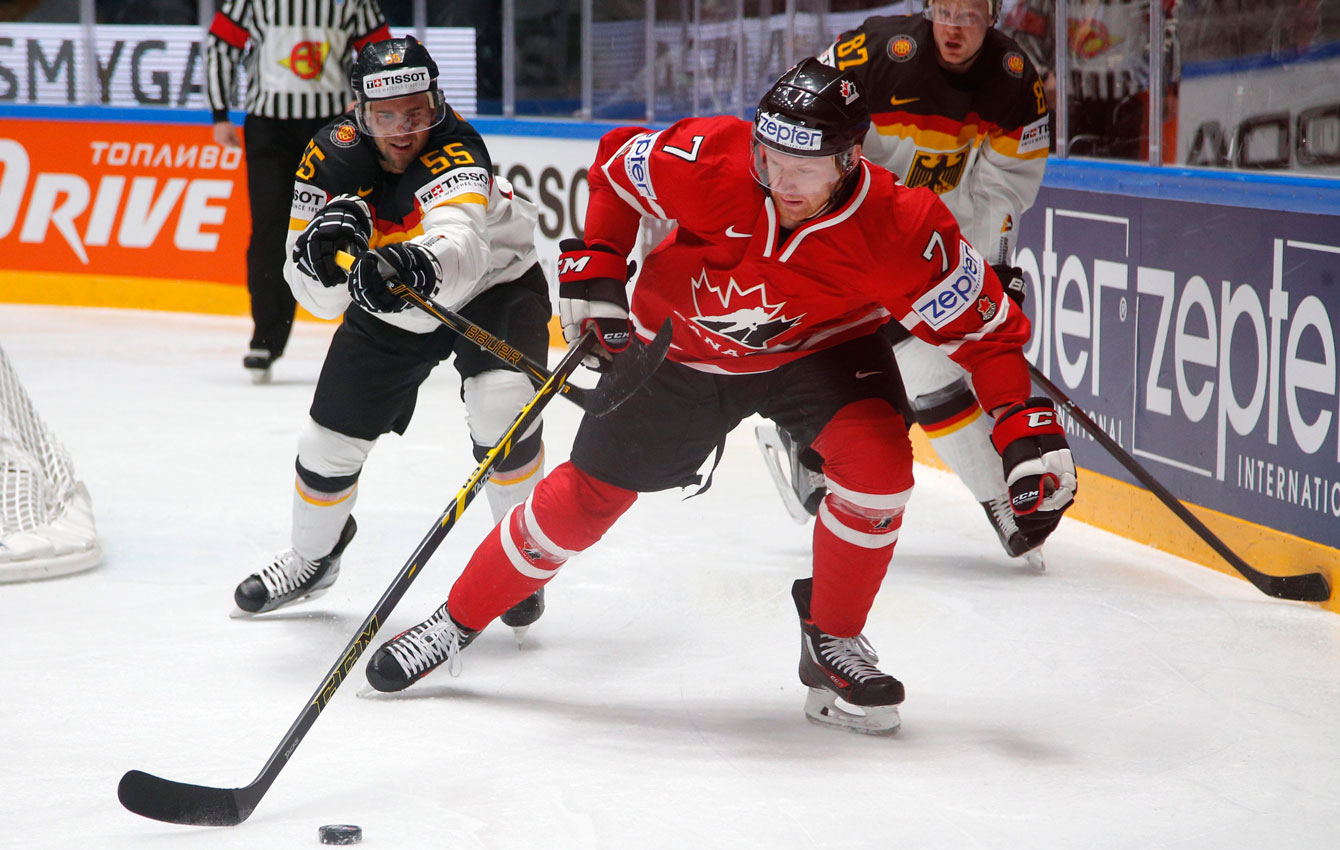 Michael Matheson, out skates Germany’s Felix Schutz at the Hockey World Championships St.Petersburg, Russia, on May 12, 2016. (AP Photo/Dmitri Lovetsky)