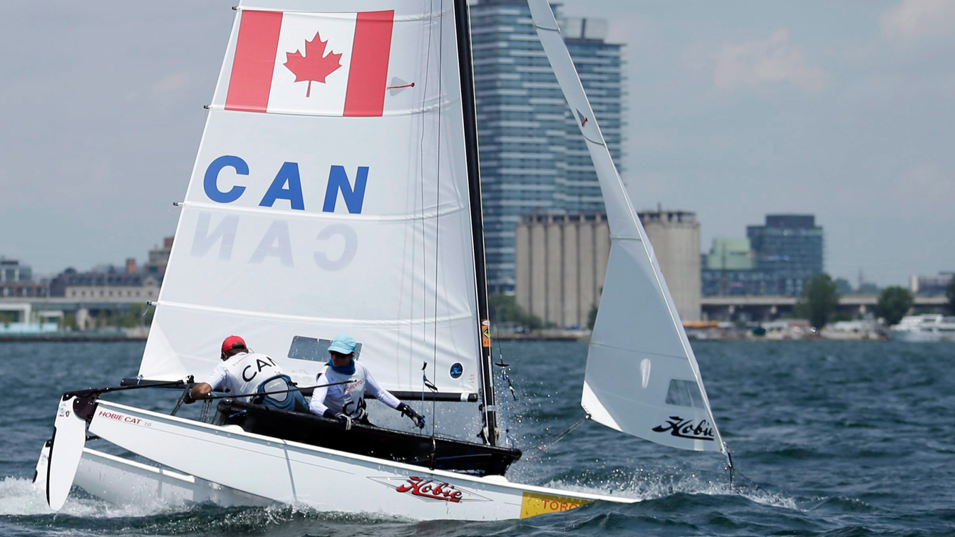 Canada's boat gets the bows underwater in the Hobie 16 medals race during sailing competition in the Pan Am Games in Toronto on July 19, 2015. (AP Photo/Gregory Bull)