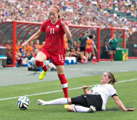 Janine Beckie, Wibke Meister Canada's Janine Beckie (11) and Germany's Wibke Meister (15) battle for the ball during second half action of the FIFA U-20 Women's World Cup quarter-finals in Edmonton, Alta., on Saturday August 16, 2014. THE CANADIAN PRESS/Jason Franson