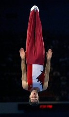 Mathieu Turgeon of Toronto performs his compulsory routine on the way to winning the bronze medal in the first ever men's trampoline competition at the Summer Olympics in Sydney on Saturday, Sept. 23, 2000. (AP Photo/Amy Sancetta)