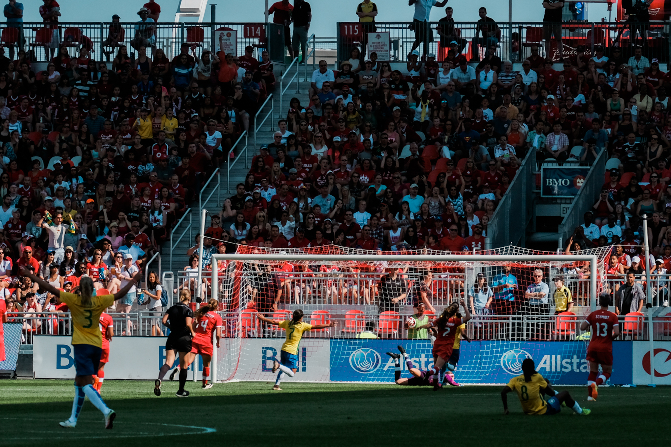 Brazilian players celebrate Marta's goal
