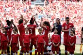 Canadian team salutes the crowd following the national anthem in Toronto