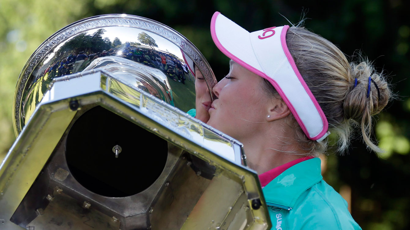 Brooke Henderson kisses the Women's PGA Championship trophy after winning her first major on July 12, 2016.