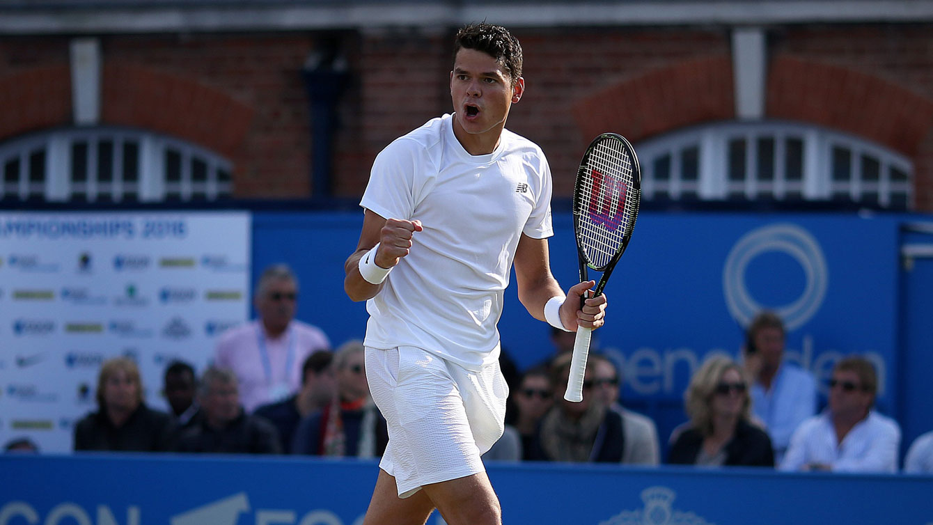 Milos Raonic celebrates during his quarterfinal match at Queen's Club Championships in London on June 17, 2016. 