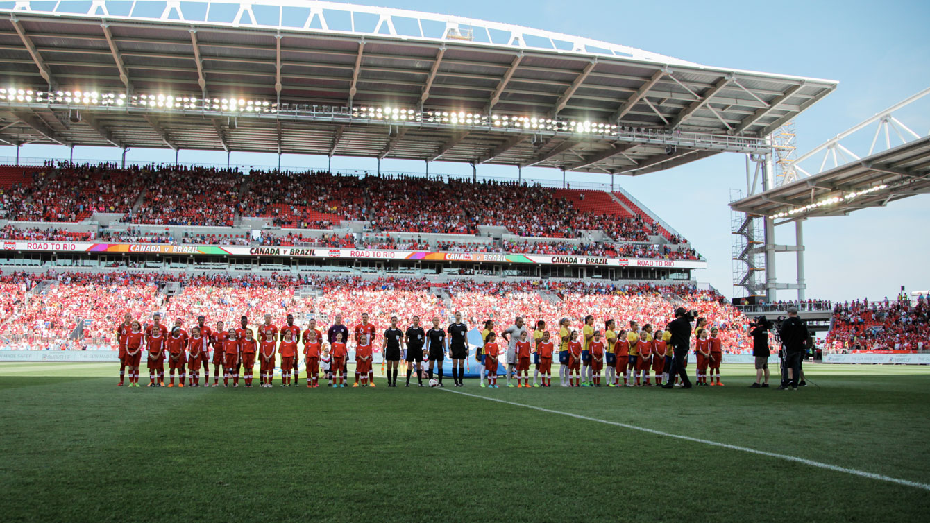 Canada (in red) and Brazil line up ahead of their international friendly