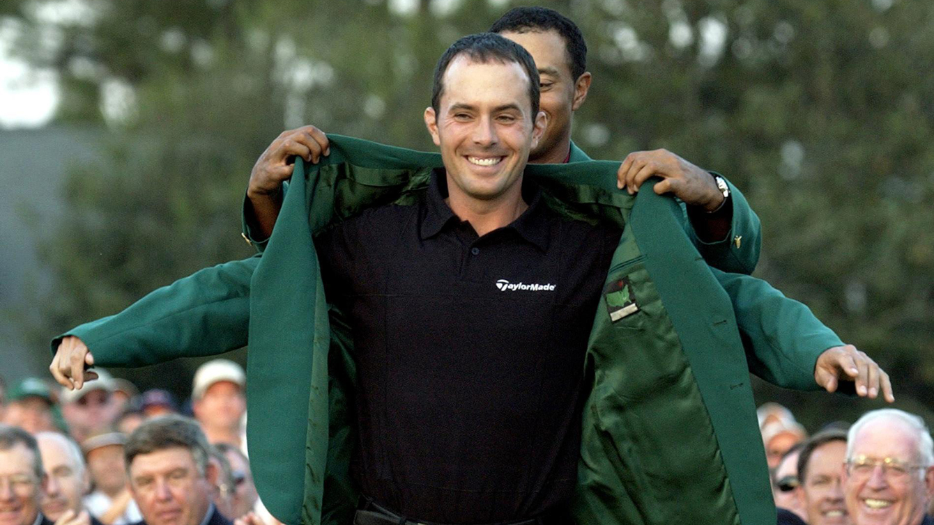 Mike Weir gets the Masters Green Jacket from Tiger Woods after winning the 2003 Masters at the Augusta National Golf Club in Augusta, Ga., Sunday, April 13, 2003 (AP Photo/Amy Sancetta)